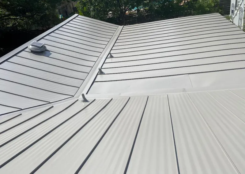 Solar attic fan installed on a metal roof for Roof Ventilation in Amsterdam